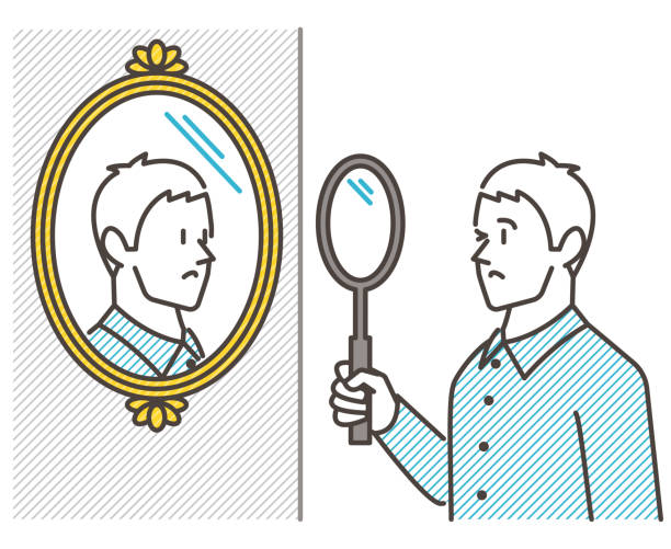 A Young Man Stares At Himself In The Mirror With A Giant Magnifying Glass.